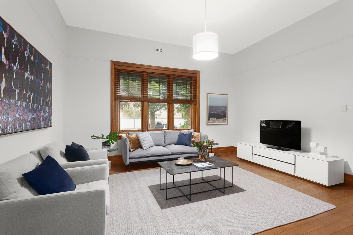 Bright and Modern Living Room With Neutral Paint and Wooden Accents