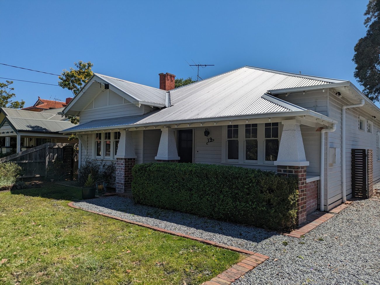 Exterior painting service in Brighton – painters refreshing the outside of a modern home